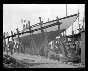 People on top of "Whirlwind" in dry dock