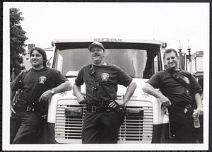 Group of three Cambridge Fire Department Rescue 2 squad members