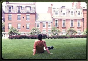 Boston 1999: A woman sits on the back lawn of the Mass State House looking at Derne St.