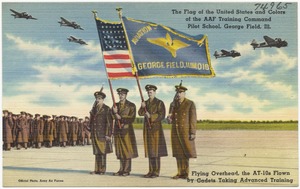 The flag of the United States and colors of the AAF Training Command Pilot School, George Field, Ill, flying overhead, the AT-10s flown by cadets taking advanced training