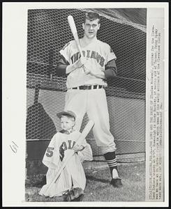 The Long and the Short of it--Sam McDowell, pitcher for the Cleveland Indians stands at 6'6". Knee-high is Ricky Buckley, 18 months old of Tucson. Young Ricky was on hand at Hi Corbett Field to watch some of the early arrivals of the Cleveland Indian team work out.