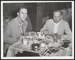 Buccaneers Feast before tackling Braves today. Left is 21-year-old pitcher Vernon Law and second baseman Monty Basgall of the Pittsburgh Pirates grabbing a bite at the Kenmore.