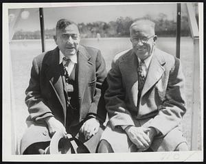 Deans of College Track Coaches and friendly rivals are these two smiling gentlemen, who were snapped as Boston College and Holy Cross held their annual outdoor track meet. At the left is Jack Ryder of Boston College and at right is Bart Sullivan of Holy Cross.