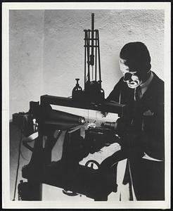 Ultra-Sensitive Machine--George A. Wahl, one of the many war scientists and engineers of Bell Telephone Laboratories and Western Electric Company, measures with microscopic precision the "force-defelection" characteristics of small parts essential in the telephones of our armed forces. This sensitive machine can record even slight changes in shape resulting from shifts in temperature and humidity.