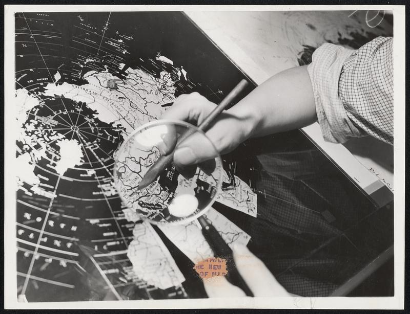 The Map Maker in a Changing World. A cartographer assisted by a ...