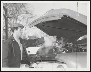 Only The Steam from frozen radiators was warm yesterday. Joe Giannino of Revere, truckman, shared this experience with hundreds in metropolitan area as morning brought below-zero temperatures, promise of even more cold weather.