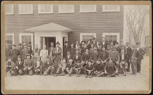 Harp shop workers in front of building