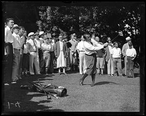 Spectators watching Gene Sarazen play golf