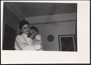 Young woman holding baby