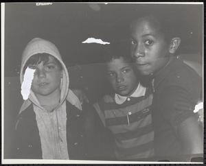 Three boys standing together