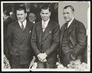 Champions at Muldoon's Funeral Two Former World Heavyweight Champions, and the Present Titleholder Got Together at the Funeral of William Muldoon, One-Time New York Fight Commissioner, and "Grand Old Man" of Sports in New York State, in New York, June 6. In Center is Jack Dempsey, and at Left is His Conqueror, Gene Tunney, Retired Champ. Jack Sharkey, Present Champion, is at Right.