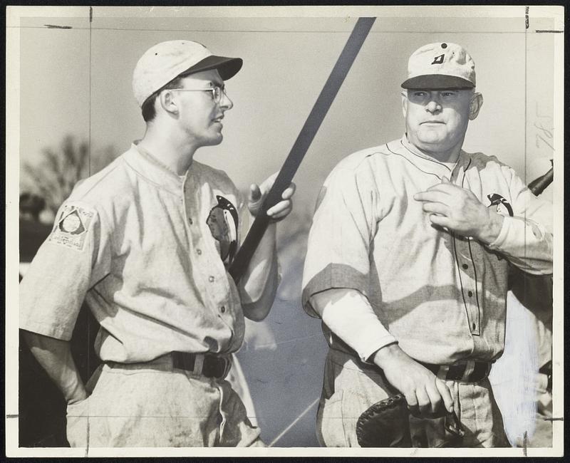 Yup, Joe Urban (left) and Jeff Tesreau, captain and coach of the Dartmouth baseball team, respectively, are seeing the world through glasses of rosy tint; the glasses belong to Capt. Joe, one of the very few catchers in baseball ever to wear spectacles, and what makes ‘em rosy is the fact that the Indians are sitting on top of the Eastern Intercollegiate League heap. Tesreau is a former spit-ball great of the Giants.