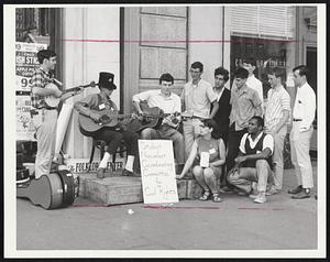 Hootenanny, part two- encouraged by their early success youngsters who began a hootenanny to raise funds for civil rights work in the South on Thursday in the Community Church Center continued it yesterday on the sidewalks of Boylston street, and raised $700 for their cause.