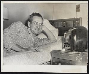 Jim Russell's Victory Smile greets the radio announcement of the last out that signalized the Braves' first game triumph over Cleveland. The Boston outfielder is in Mercy Hospital, Pittsburgh, under treatment for a heart ailment.