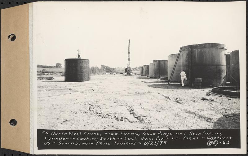 Contract No. 85, Manufacture and Delivery of Precast Concrete Steel Cylinder Pipe, Southborough, Framingham, Wayland, Natick, Weston, #6 northwest crane, pipe forms, base rings, and reinforcing cylinder, looking south, Southborough, Mass., Aug. 22, 1939