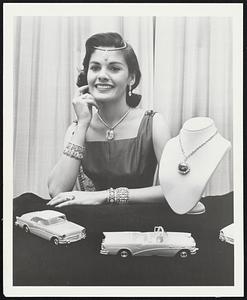 $2,000,000 Gem Display at Motorama Wearing a million dollars worth of diamonds, and with the famed Hope diamond on her left, Model Mary Gardiner displays the $2,000,000 jewel collection Buick will show at the General Motors Motorama in New York. The jewels, from the collection of Harry Winston, include a 42-carat pear shape, diamond and a 127-carat diamond pendant, plus a $225,000 diamond ring and a $72,000 bracelet.