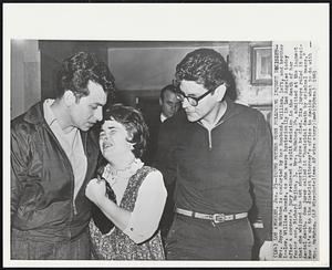 Young Mother Sobs Following Inquest Desicion--Mrs. Joyce McMahon is comforted by her husband, William, left, and brother-in-law, William Dennis, as she weeps hysterically in Los Angeles today after a coroner's jury returned a split decision in the death of her foster son, Richard Mojica, 3. Mrs. McMahon, 24, admitted at the inquest that she whipped the tot shortly before he died. Six jurors ruled it accidental death. One juror called it "homicidal death by criminal means." Now it's up to the district attorney's office to decide what to do with Mrs. McMahon.
