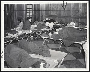 Evacuees Bunk in Town Hall -- Evacuees from Swift's Beach, Wareham, turn in at the Wareham Town Hall for a night's sleep in the improvised bunk-room.