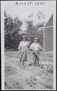 Hiram and Julia Zoly cultivating the garden
