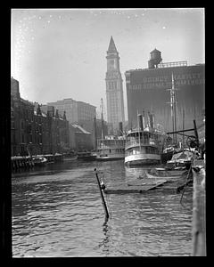 Steamboats "Newcastle" and "Catherine" in foreground, Quincy Market Cold Storage and Warehouse and Custom House Tower in background