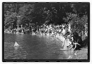 Boys sending out model sailboats