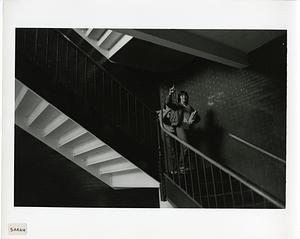 Two students in a stairwell