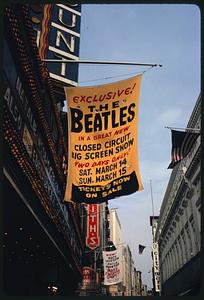 Banner outside Paramount Theater advertising Beatles "closed circuit big screen show," Boston