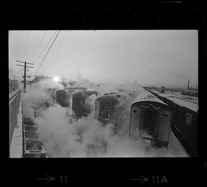 Steam rises from commuter trains in winter, South Boston