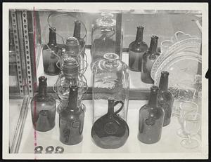 Rare collection of wine bottles from the Thomas Fayerweather estate of Torry Row, Cambridge. It is of the late 18th century and each bottle has its own private mark.