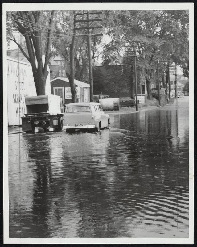 Running Tide Bridge Street, Salem, is awash after sudden storm which