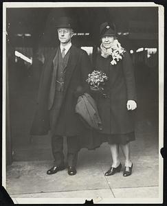 Charles Francis Adams of Boston, the new Secretary of the Navy, with Mrs. Adams arrives at the Union Station in Washington for the innauguration.