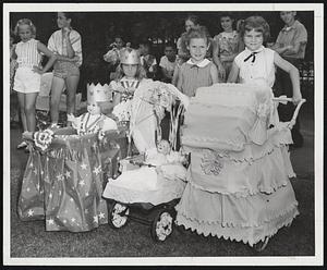 Proud "Little Mother" are these winners of a doll carriage parade sponsored by the Brookline Recreation Department yesterday at Emerson Park. They are (left to right) Donna Tynan, 100 Davis Ave., second prize; Lorraine Patterson, 38 White Place, third prize; Linda Alfuso, 13 White Place, first prize.