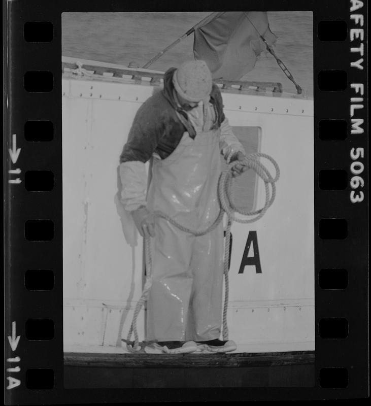 Man on boat with rope