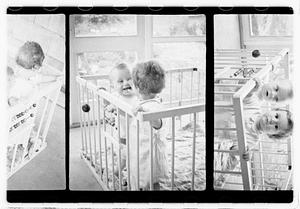 Two children in a playpen