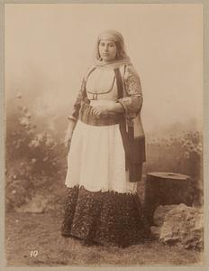 Studio portrait of woman in traditional Greek dress