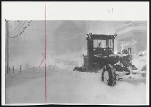 Heavy Snow In Maine - Shown above is one of the many plows trying to keep the main streets open in Bangor after being lashed with a wind driven 15 inch snowfall that was still raging late Sunday afternoon and evening.