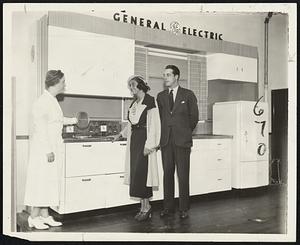 Leslie Blake, debutante star of the Vincent Club show, being shown the convenience of a “planned kitchen” by an Edison demonstrator and Thomas J. Kedian, vice president of Clifford V. Miller Inc., exclusive agents for the all-electric homes now under construction at College Heights, Chestnut HIll.