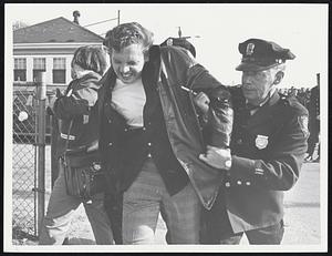 Picket hustled out of Picket line at Bennet St entrance of G.E. plant in Lynn after trouble erupted. The man was not arrested.