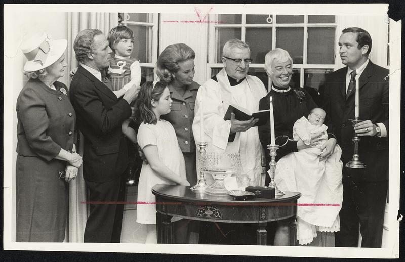 Mayor White's New Daughter, Patricia, christened last night. From left, Mrs. Patricia White, the mayor's mother; the mayor and son, Christopher, 21/2; daughter Caitlin, 10; Mrs. White; the Rev. Gerald L. Bucke of St. Joseph's Church. West End Mrs. Barbara Cameron of Hyde Park, the godmother; Baby Patricia, and Richard Dray. the godfather.