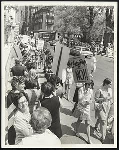 Mothers and Grandmothers march outside the State House yesterday protesting in the Cambodian action and other issues.