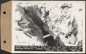 Contract No. 70, WPA Sewer Construction, Rutland, sewer trench showing 6 in. water main one foot right of center line Sta. 43+61.78, looking ahead, Rutland Sewer, Rutland, Mass., Sep. 15, 1942
