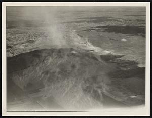 A Montana Dust Storm in Action. Glendive, Montana -- Riding an aeroplane at an elevation of 10,000 feet above a dust storm with a seventy-five mile gale whipping the wings of your plane can well visualize that those Montana wheat growers are up against. This picture taken near Glendive Montana, shows farm lands being whipped into the skies shortly after being planted. The picture was taken May 4th 1937.