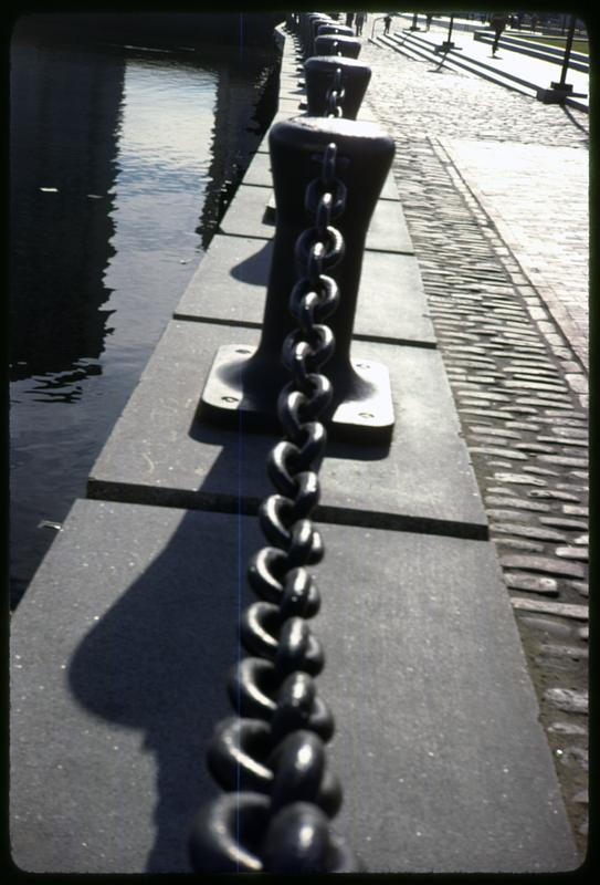 Chain on posts by the edge of a wharf