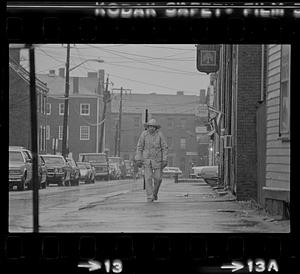 Man on Middle Street in rain gear