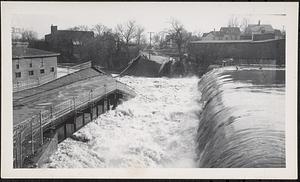 Main Street bridge being destroyed by flood waters