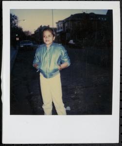 Girl standing with hands in pockets