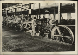 Man standing at braiding machinery