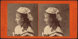 Profile of young woman wearing hat