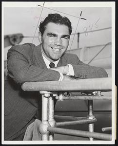 Here To See Championship Fight New York City - Max Schmeling, former heavyweight boxing champion of the world, pictured on board the North German Lloyd liner Bremen August 18 upon his arrival here from abroad. He is here to attend the bout between Joe Louis, present heavyweight champion of the world, and Tommy Farr, British champion, at Yankee Stadium August 26. After seeing the fight he intends to go hunting in Canada.