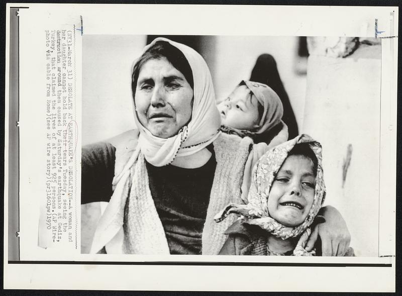 Desolate at Earthquake's Desolation--A woman and her daughter cannot hold back their tears Tuesday, seeing the destruction around them caused by Saturday's earthquake at Gediz, Turkey, that claimed the lives of at least 925 persons.